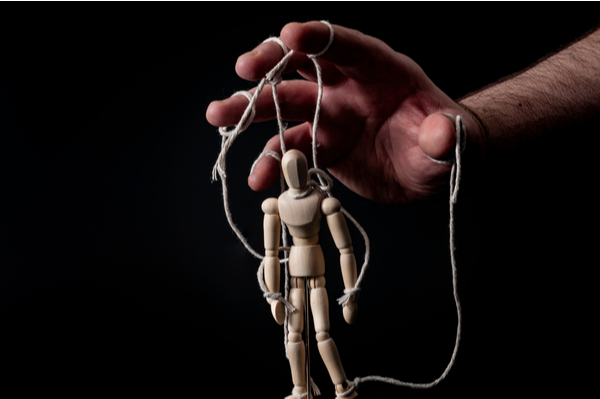 Hand controlling marionette puppet